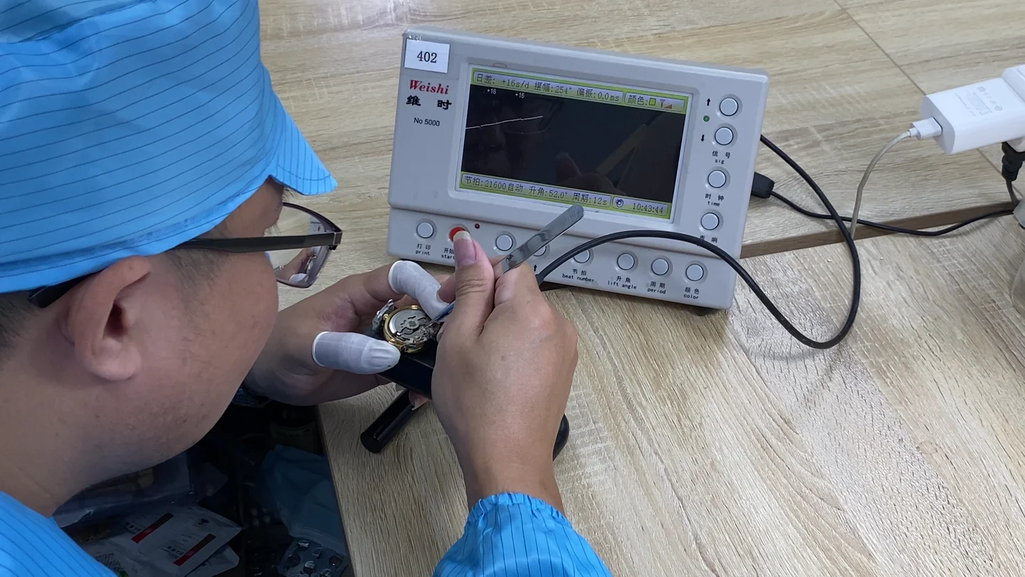 An operator working with a watch timing instrument