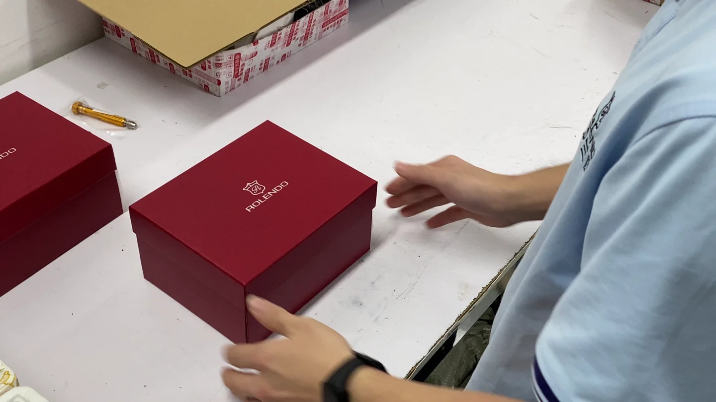ROLENDO watches being placed in presentation boxes