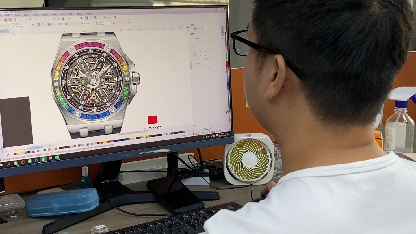 Watch design drawings reviewed on screen